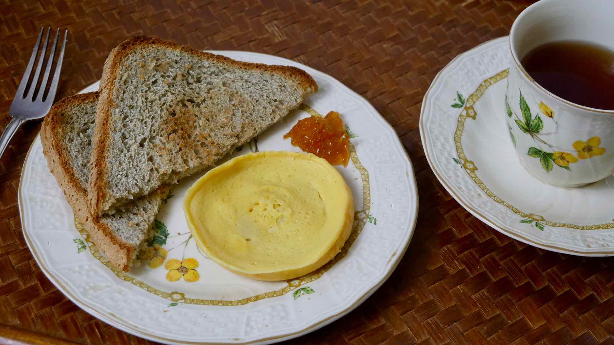 breakfast egg from dried eggs cooked in microwave with toast and tea