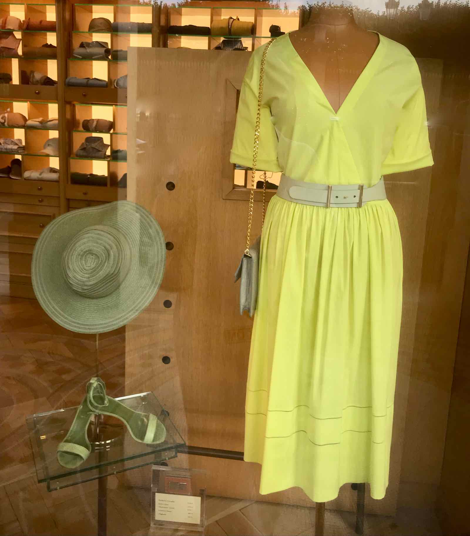lemon yellow belted dress with handbag, hat and sandals in neutral gray color