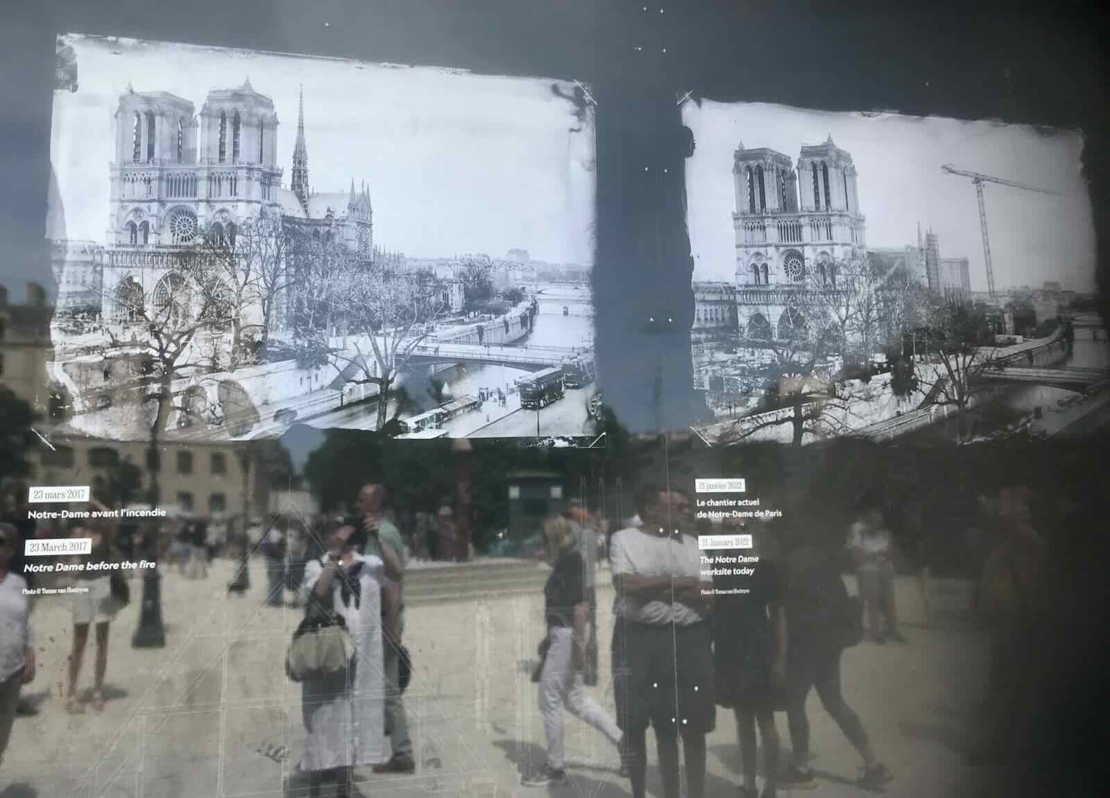 restoration progress billboard and crowd at Notre Dame de Paris