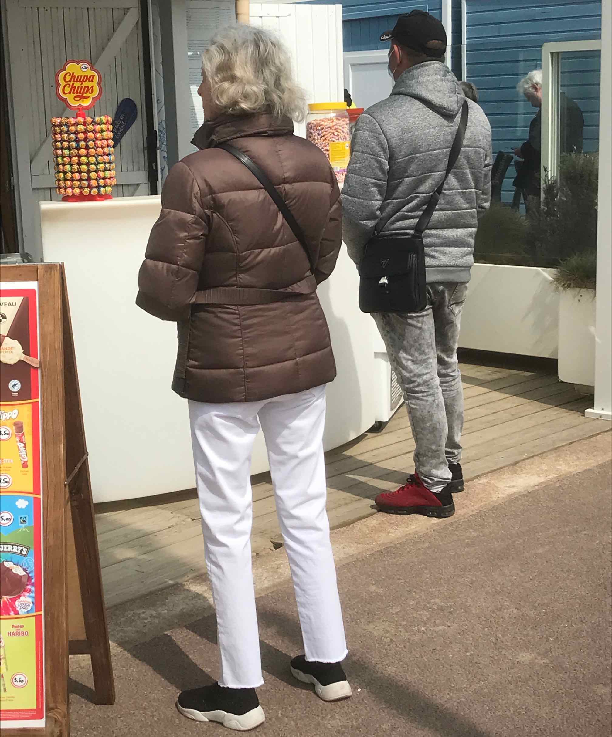 woman and man in line to buy French ice cream