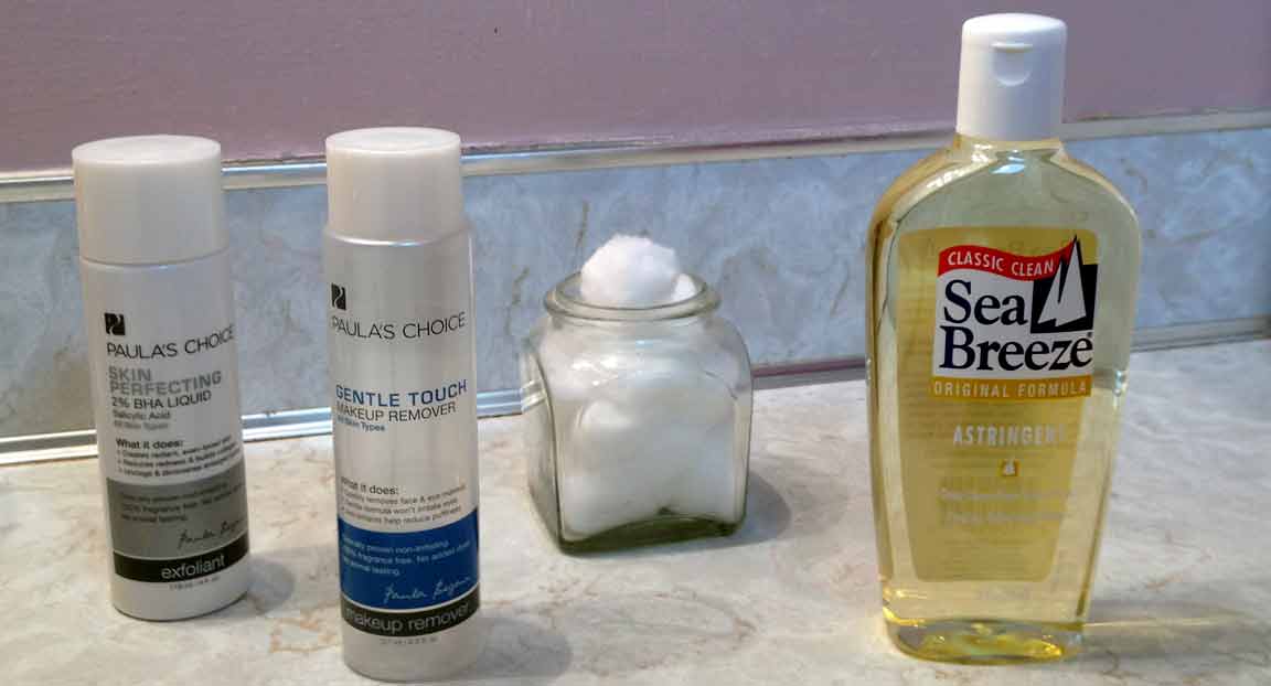 Sea Breeze Astringent and Paula's Choice Makeup Remover with jar cotton balls